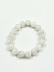 White beaded bracelet on a white background